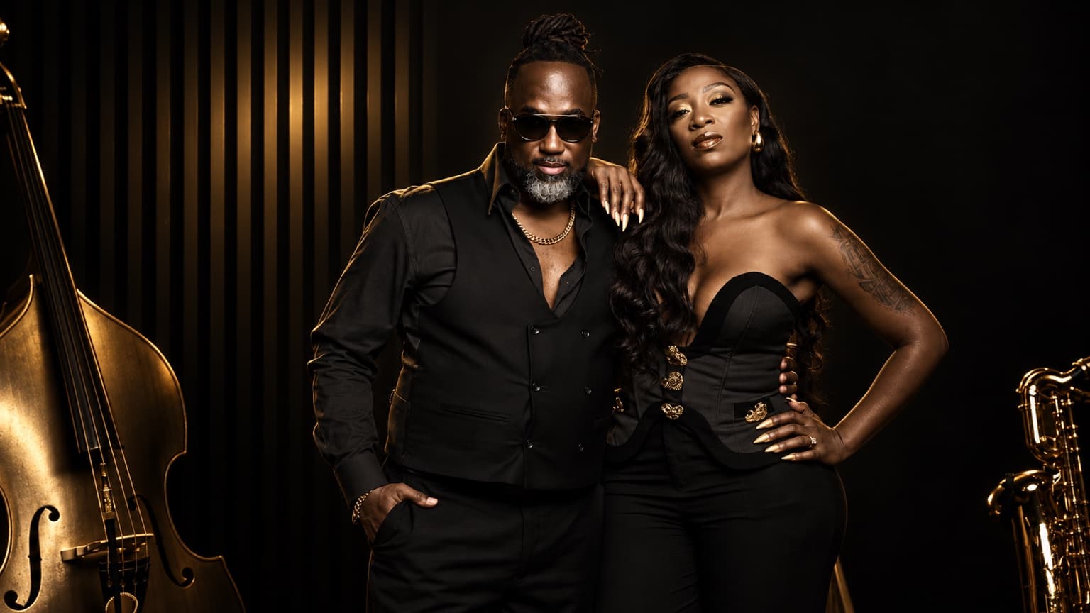Charmin Greene and Jermaine Williams in a black-and-gold portrait